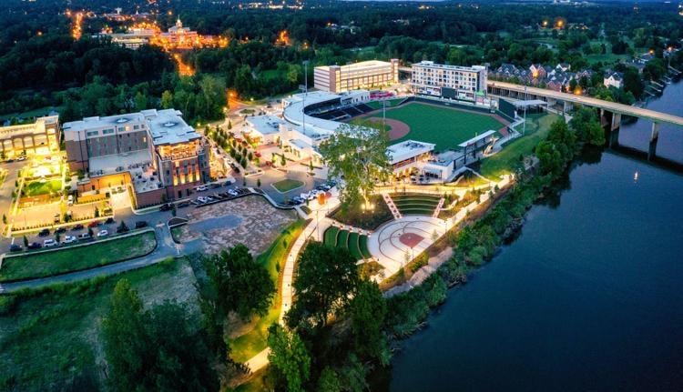 North Augusta riverfront at night — mixed-use development with baseball stadium